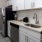 Kitchen space with white brick backsplash