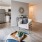 Open spaced living room with natural light and hardwood floors