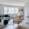 Spacious living room with natural light and hardwood floors 