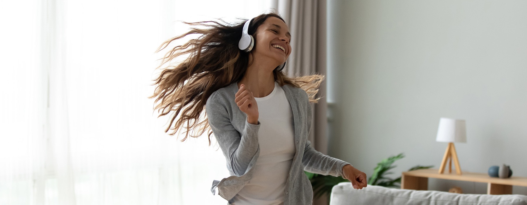 Girl listening to music and dancing